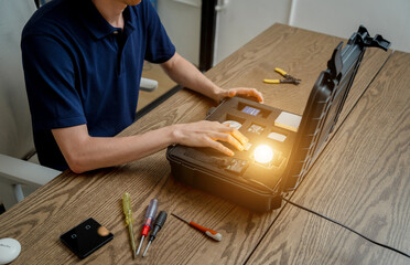 A technician works with a demo kit of the smart home system
