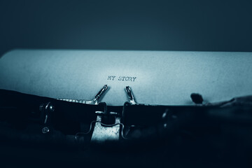 MY STORY typed words on a vintage typewriter. Close up. Antique Typewriter.