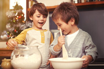 Obraz na płótnie Canvas Boys, baking and happy in kitchen with flour, home and learning with ingredients for christmas cake. Children, mixing or bowl for cookies on counter, biscuits or pastry recipe for holiday celebration