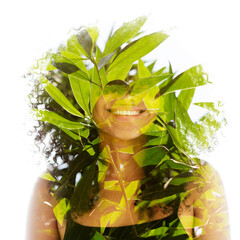 A double exposure portrait of a young smiling woman merged with leaves - 754691689