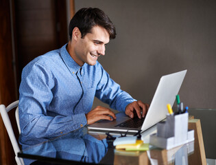 Businessman, laptop and typing in office professional, salesman and working in workplace. Male person, smile and happy with computer or research, corporate and technology for connectivity or project