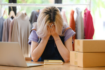 Business owner SME Small business stress depress serious about own online shop, Young owner business angry sad disappointed with her business