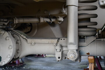 Rear axle on military vehicle, jacked up.