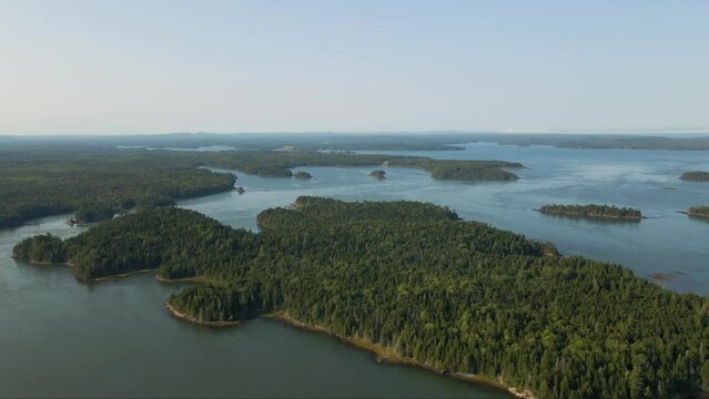 above the tranquil marina with this mesmerizing drone aerial footage. Watch boats gently bob on the still waters as the camera gracefully glides over the river, capturing the interplay of sun and ripp