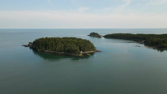 above the tranquil marina with this mesmerizing drone aerial footage. Watch boats gently bob on the still waters as the camera gracefully glides over the river, capturing the interplay of sun and ripp