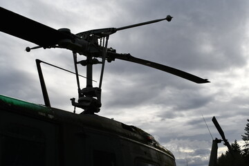Helicopter rotor, dark in the evening light.