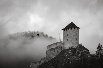 Black&white photo of the old fort on the hill with clouds in background, Uzice, Serbia
