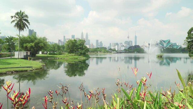 Kuala Lumpur skyline. The Petronas Towers are reflected in water