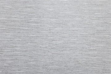 Stylish grey wallpaper as background, closeup view