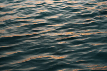 Reflections of the light along the water at sunset