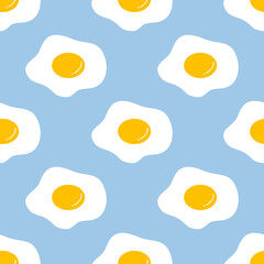 Seamless pattern cute fried eggs on blue background. Vector illustration.