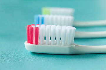 several toothbrushes on a blue background