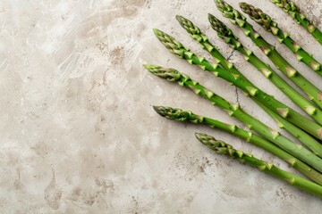 fresh green asparagus on a light beige concrete kitchen background