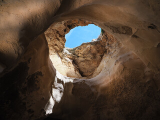 Cave with a hole looking into the sky