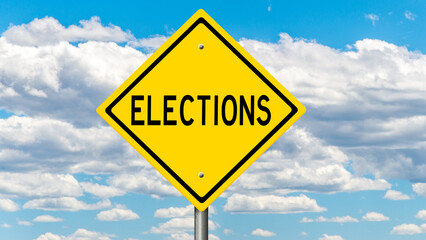 Yellow diamond highway sign with clouds and blue sky with message 