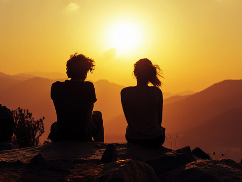 Silhouettes of two young women watching colorful sunset at mountains, Affectionate friends: Lesbian couple enjoys dawn in mountain landscape, radiating love. AI generated image