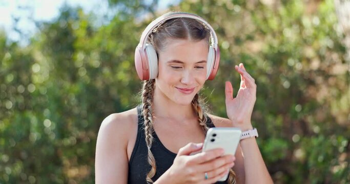 Woman, headphones and phone for music, runner and streaming radio for fitness workout in nature. Female person, cardio and app or website for playlist, audio subscription and training for marathon