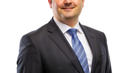 Confident businessman in a suit smiles, exuding success and professionalism