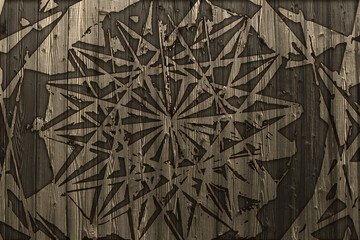 Image texture of an old dark brown board fence with a geometric gothic star pattern.