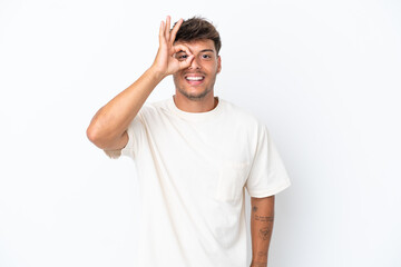 Young caucasian handsome man isolated on white background showing ok sign with fingers