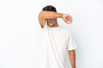 Young caucasian handsome man isolated on white background covering eyes by hands