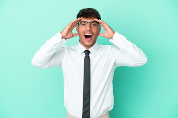 Business caucasian man isolated on blue background with surprise expression