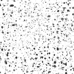 Abstract texture of black splashes on a white background.