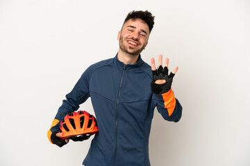 Young cyclist man isolated on white background happy and counting four with fingers - obrazy, fototapety, plakaty