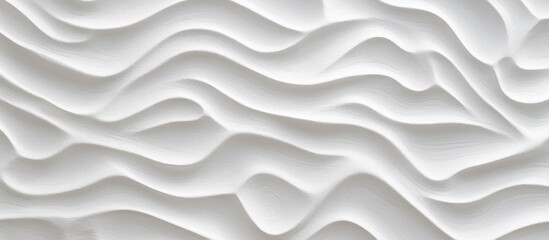 A close-up view of a white wall with undulating wavy lines creating a textured pattern. The lines appear to be part of the walls surface, adding visual interest to the otherwise plain backdrop.