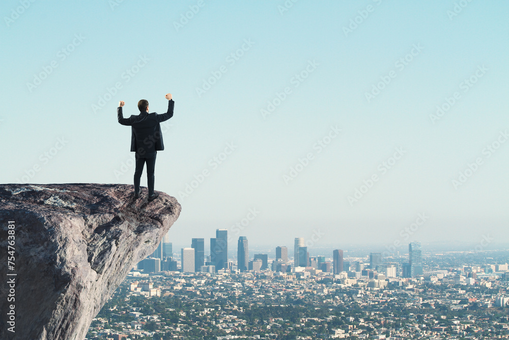Poster back view of man standing on cliff edge on bright blue sky with mock up place background. future, su