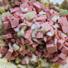 chopped sausage, with cucumbers and onions for the sausage salad