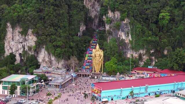 stairs Batu cave giant golden Buddha statue Best aerial top view flight drone 