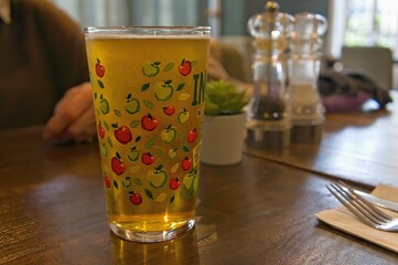 Pint of cider drink with an apple design on the glass