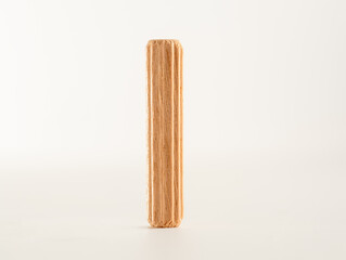 close up of a single Wooden fluted Dowel pinisolated on a white background