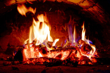 The fiery glow emanates from burning wood, lighting up the area.
