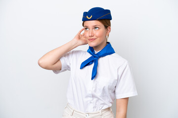 Airplane stewardess woman isolated on white background thinking an idea