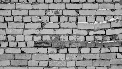 Black and white Brick Wall. Large gaps between the bricks