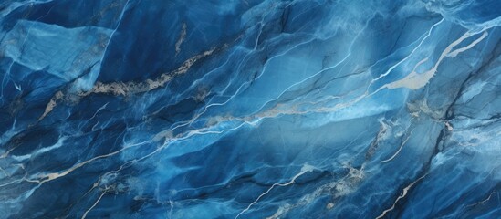 Detailed view of a blue marble surface, showcasing intricate patterns and textures found in the stone. The close-up reveals the unique characteristics of the blue marble.