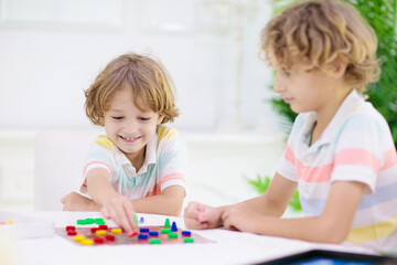Fototapeta premium Family playing board game. Kids play.
