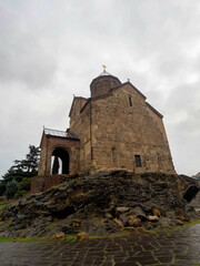 Fototapeta na wymiar The metekhi church with grey rain cloud, tbilisi, Georgia.