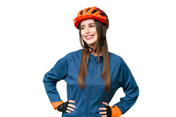 Young cyclist woman over isolated chroma key background posing with arms at hip and smiling - obrazy, fototapety, plakaty
