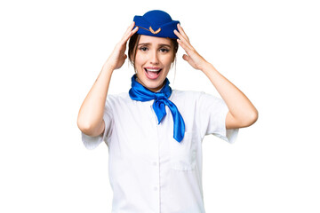 Airplane stewardess over isolated chroma key background with surprise expression