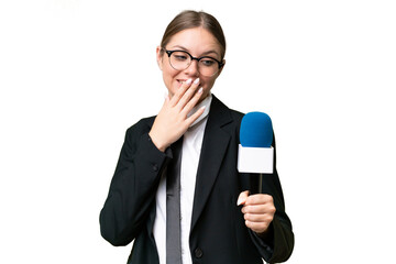 Young TV presenter caucasian woman  over isolated background with surprise and shocked facial expression