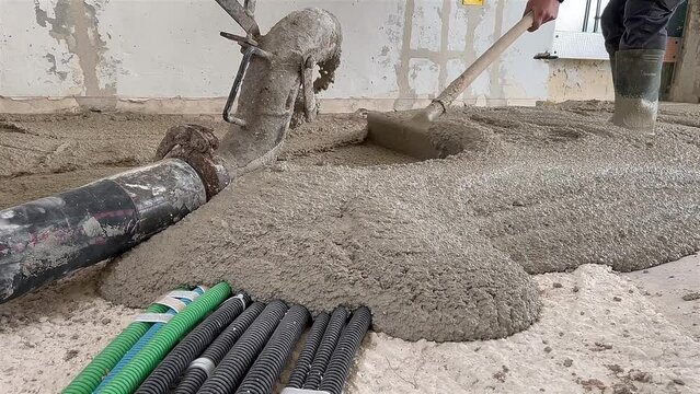 Casting of sand and cement with pump for a screed covering system pipes 2