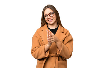 Young blonde woman over isolated chroma key background applauding after presentation in a conference