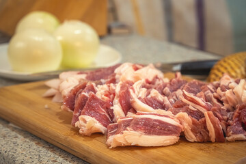 Sliced fresh fatty meat for further cooking. Close-up