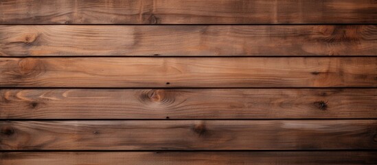 A detailed close-up of a wooden plank wall, showcasing the natural grain and texture of the wood. The individual planks are tightly fitted together, creating a rustic and warm atmosphere.
