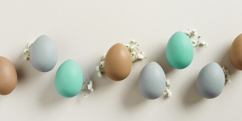 Pastel Easter Eggs as minimal pattern with white blooming Flowers on beige color, top view colorful...