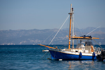 A fishing boat on the jetty in the village of Loggos, Paxos, Greece