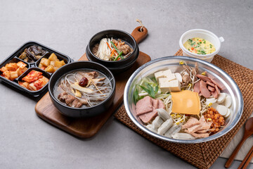 Korean food, budae jjigae, galbitang, earthen pot, bulgogi, pork belly, grilled, side dishes, kimchi, cucumbers, potatoes, vegetables